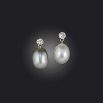 A pair of natural pearl and diamond earrings, each set with a circular-cut diamond suspending a