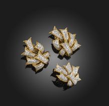 A gold and diamond demi-parure, 1960s, comprising: a pair of ear clips and a ring, each designed