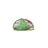 An Art Deco jadeite and enamel brooch, 1920s, set with a section of jadeite carved as a boat with