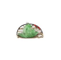 An Art Deco jadeite and enamel brooch, 1920s, set with a section of jadeite carved as a boat with