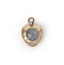 A gold and chalcedony pendant, 19th century and later, designed as a heart engraved with foliate