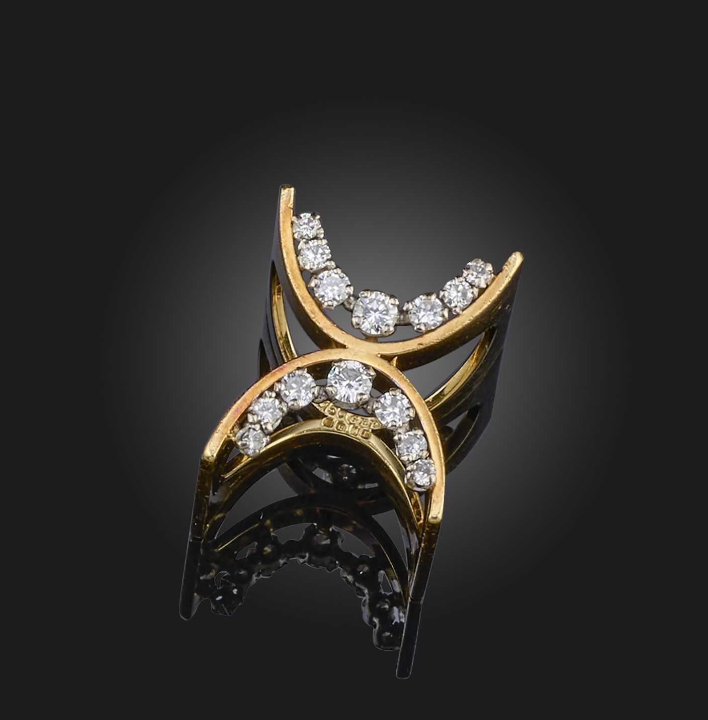Φ Φ Gilian Packard, a diamond ring of sculptural design, the connecting arcs each set with graduated