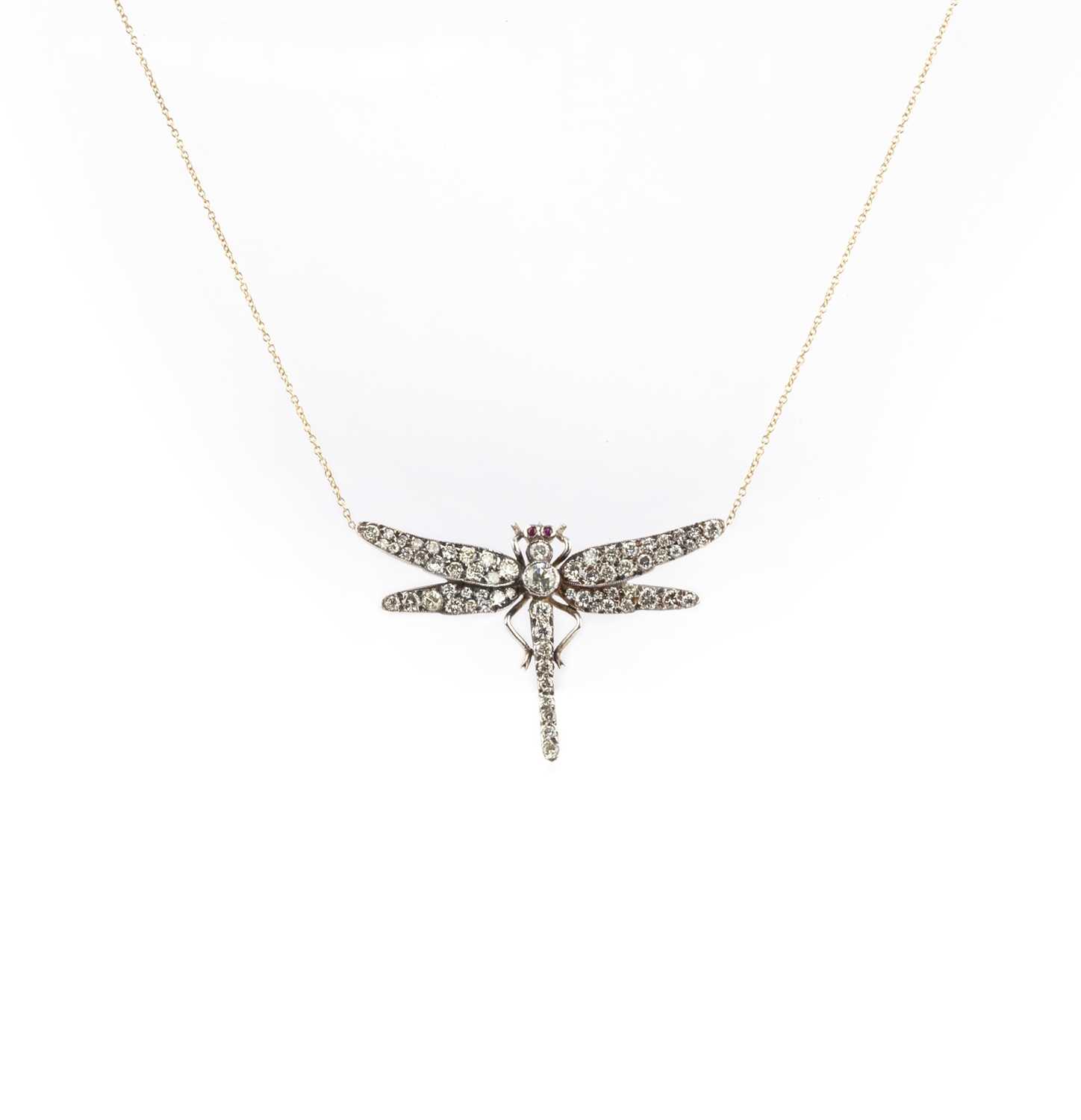 A diamond pendant necklace, designed as a dragonfly, set with brilliant-cut diamonds, its eyes set