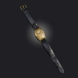 Patek Philippe, a gentleman's gold dress watch, mid 20th century, tonneau-shaped gilt dial with