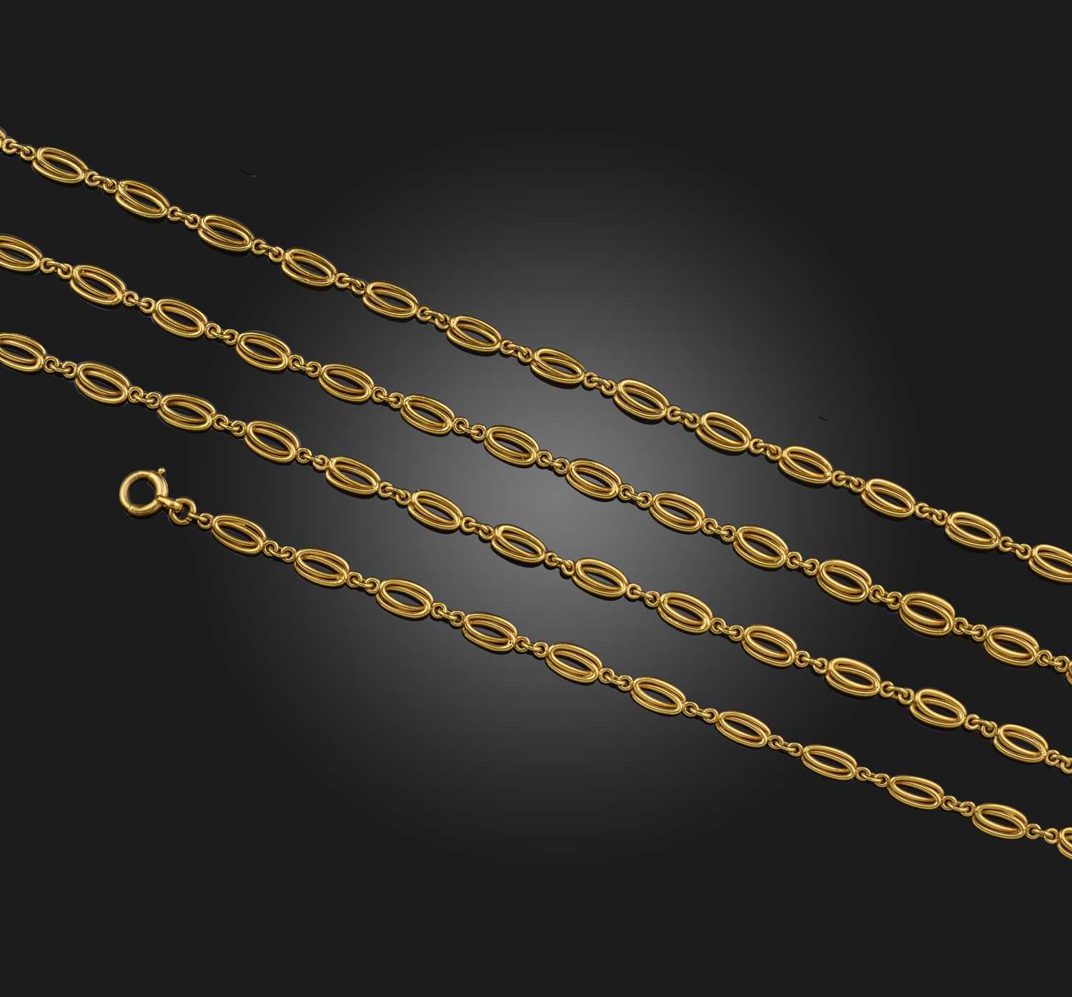 A gold longchain, France, late 19th century, composed of interlocking oval links in gold wire,