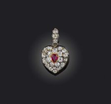 A ruby and diamond locket pendant, designed as a heart, set with cushion-shaped diamonds and a
