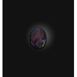 †A loose solid black opal weighing 2.21cts