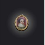 λ A George III portrait miniature mourning jewel, early 19th century composite, of oval outline, set