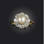 A natural pearl and diamond ring, set with a central pearl within a surround of old cushion-shaped