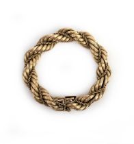 A gold bracelet, Italy, mid 20th century, of rope twist design, composed of engraved gold links