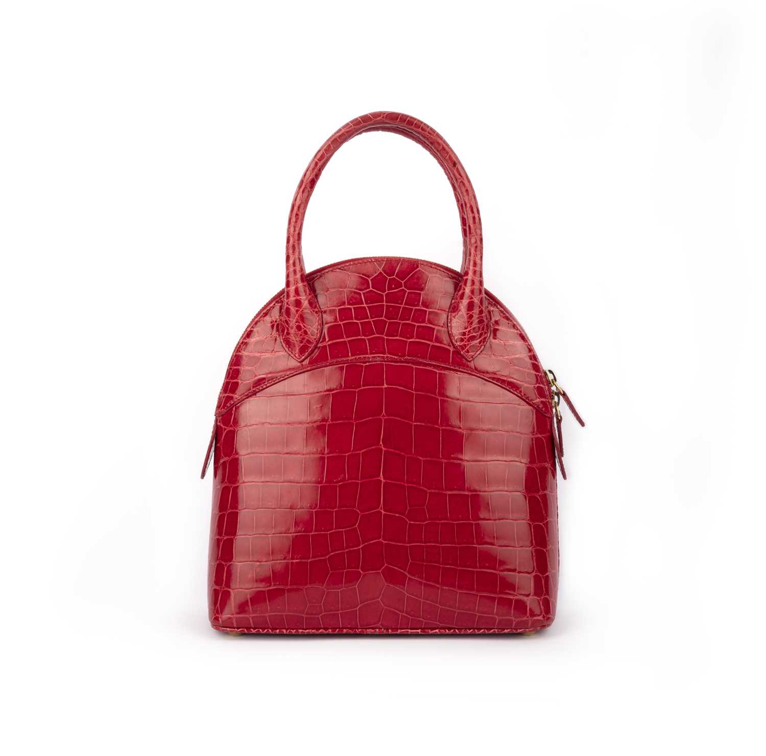 λ Asprey, a raspberry crocodile top handle bag 24cm wide, 26cm high, 42cm strap drop, includes