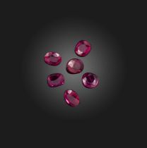 † † Six oval-shaped faceted rubies, weighing 5.86cts total Accompanied by four reports from AGL