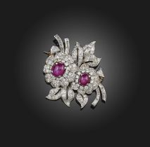 A star ruby and diamond brooch, mid 20th century, designed as a spray of flowers, set with two