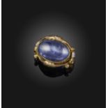 A star sapphire and diamond ring, late 19th century, set with a cabochon star sapphire weighing