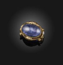 A star sapphire and diamond ring, late 19th century, set with a cabochon star sapphire weighing