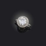 An Art Deco diamond cluster ring, set with a circular-cut diamond weighing 2.08cts, within a