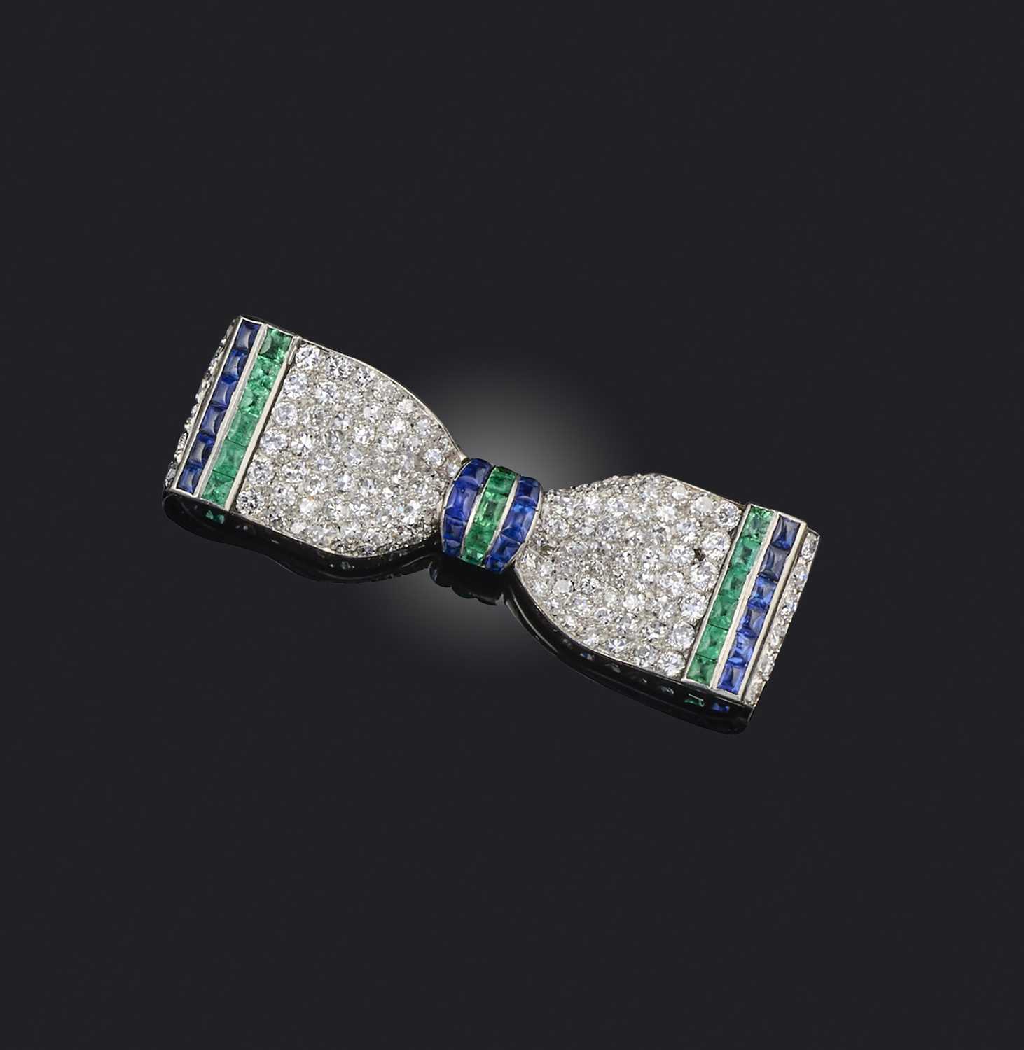 Henri Picq, an Art Deco emerald, sapphire and diamond brooch, 1920s, naturalistically modelled as