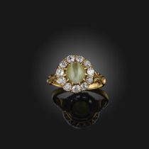A cat's eye chrysoberyl and diamond ring, late 19th century, of cluster design, set with a