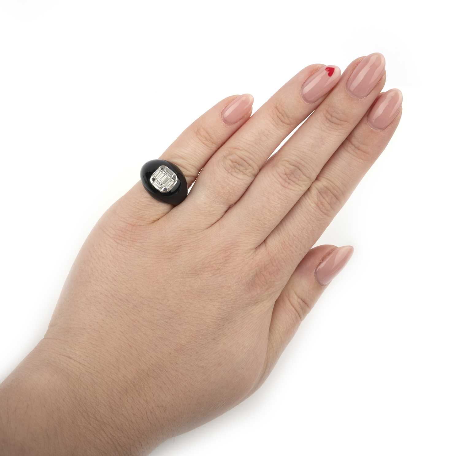 A black enamel and diamond dress ring, of bombe design, set with a cluster of baguette-shaped - Image 2 of 2