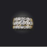 A three row diamond ring, set with graduated old circular-cut diamonds in platinum and 18ct yellow