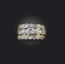 A three row diamond ring, set with graduated old circular-cut diamonds in platinum and 18ct yellow