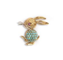 A turquoise and ruby-set gold rabbit brooch, of stylised design, the body pave-set with turquoise