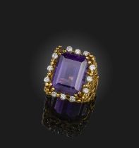 George Weil, an amethyst and diamond ring, 1970s, set with a step-cut amethyst, within a border of