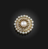 A natural pearl and diamond pendant/brooch, late 19th century, of circular outline, centring on a