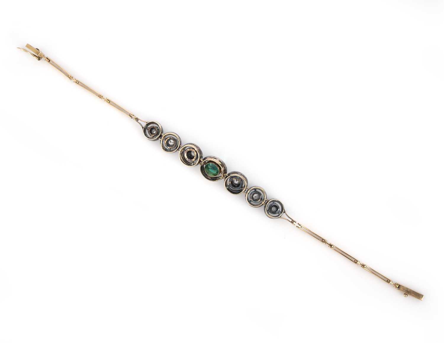 An emerald cabochon and diamond bracelet, set with a central sugarloaf emerald, within articulated - Image 2 of 2