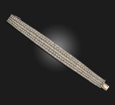 A pearl and diamond bracelet, late 19th/early 20th century, composed of tapering bar links set