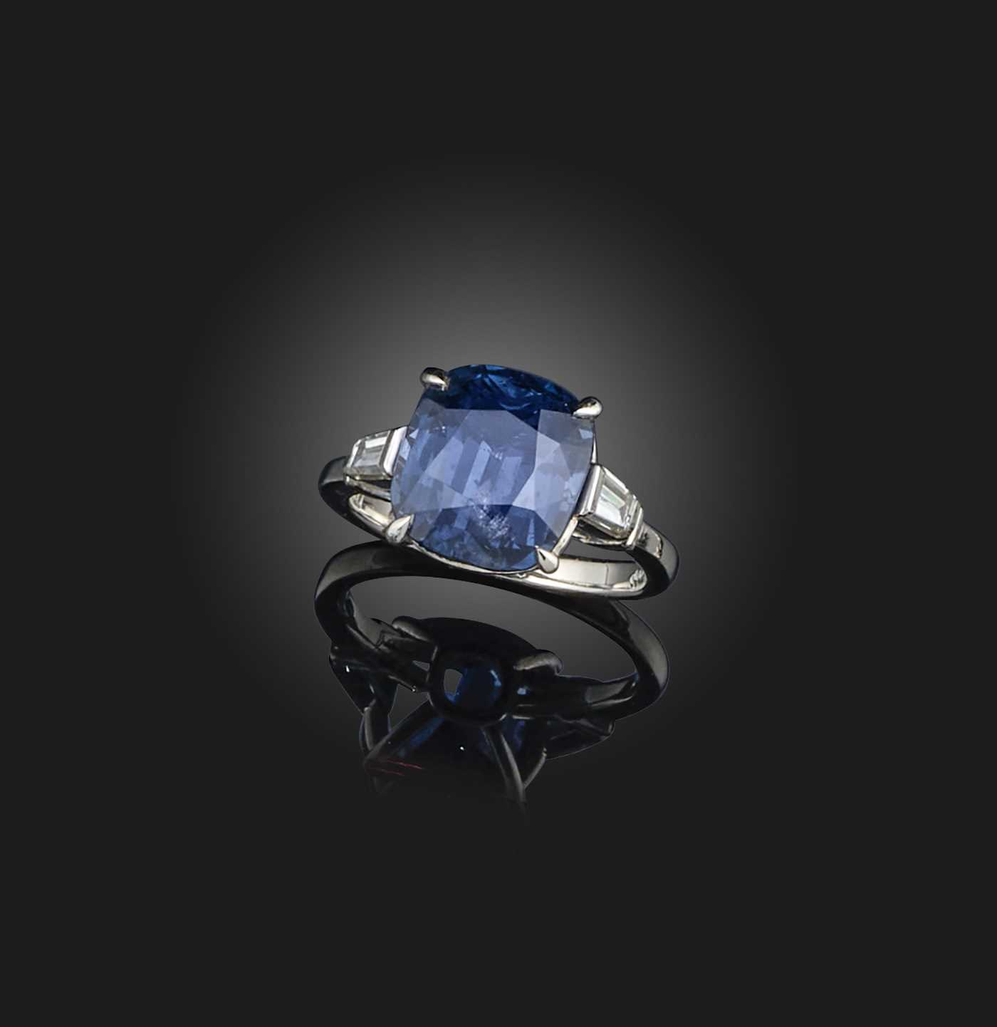 A blue spinel and diamond ring, set with a cushion-shaped blue spinel weighing 6.63 carats,