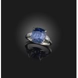 A blue spinel and diamond ring, set with a cushion-shaped blue spinel weighing 6.63 carats,