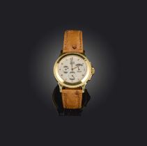 Corum, a gold 'Reverse de Marche' watch, ref.73.109.56, signed guilloché dial with subsidiary