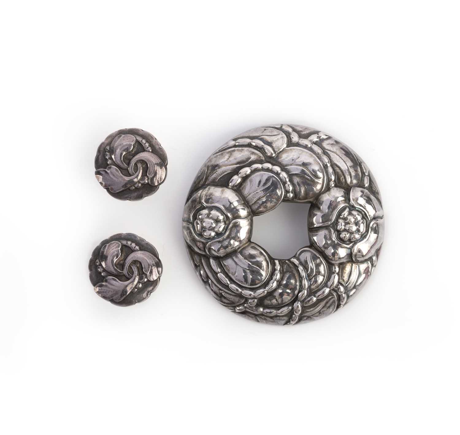 Georg Jensen, a silver brooch and pair of earrings, circa 1994, comprising: a silver brooch modelled