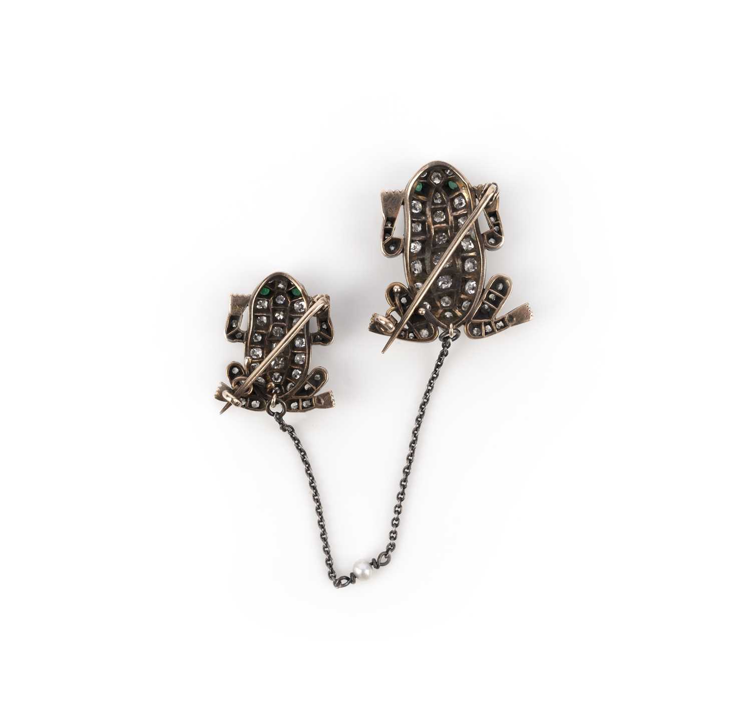 A pair of diamond and emerald brooches, designed as frogs, set with circular-cut diamonds totaling - Image 2 of 2