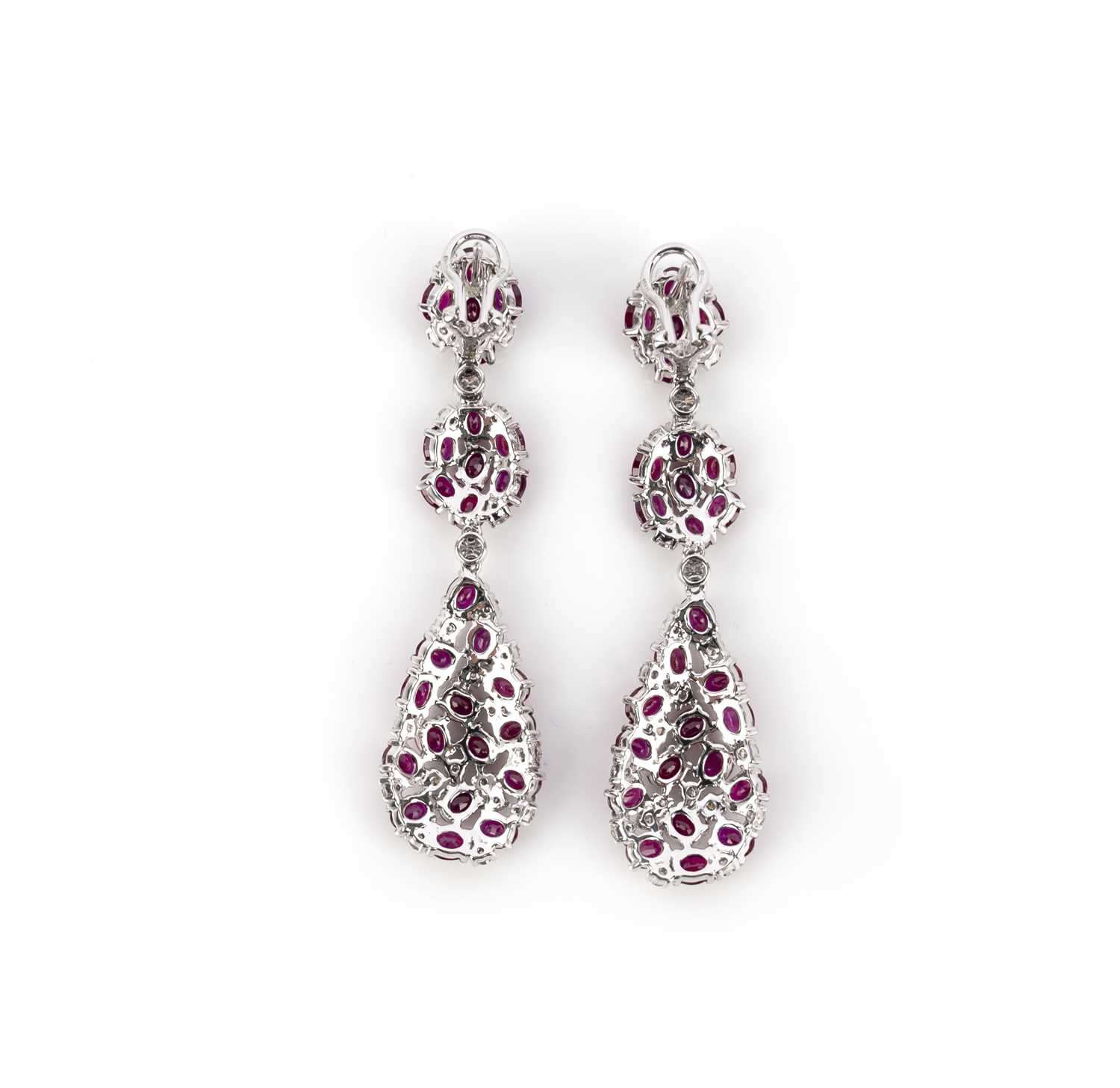 A pair of ruby and diamond earrings, each of pendent design, composed of three sections set with - Image 2 of 3