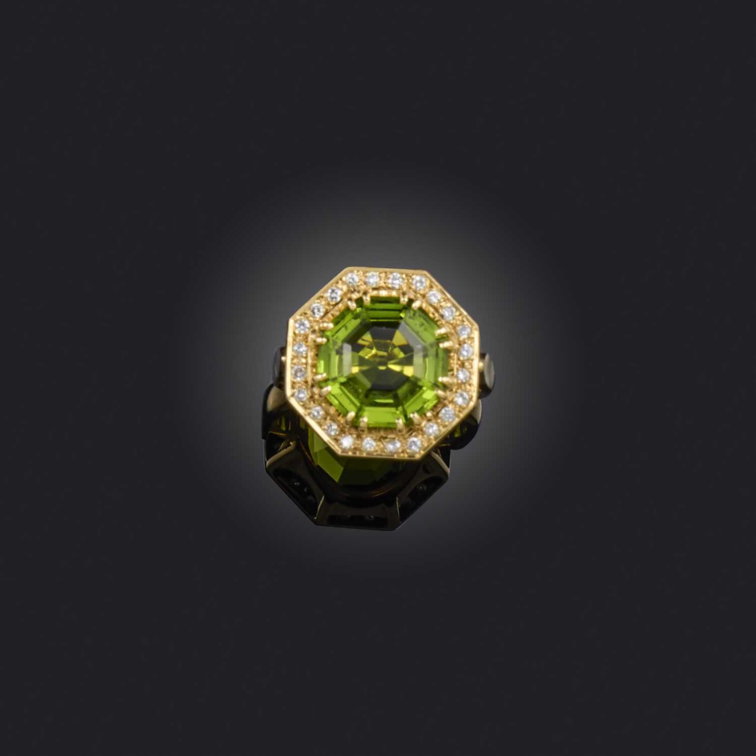 A paste and diamond cluster ring, of octagonal form, centring on a green paste within a surround