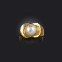 A natural pearl ring, mid 20th century, set with a pearl measuring approximately 10.31 x 9.73 x 8.
