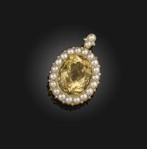 A citrine and pearl pendant, mid 19th century, set with an oval citrine, within a border of half