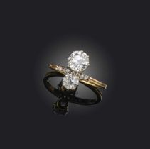 A diamond ring, early 20th century, set with two circular-cut diamonds weighing approximately 1.28