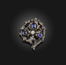 A Victorian sapphire and diamond brooch, late 19th century, designed as a foliate spiral, set with