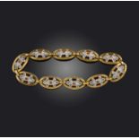 A ruby and diamond bracelet, early 20th century, composed of navette-shaped links centring on