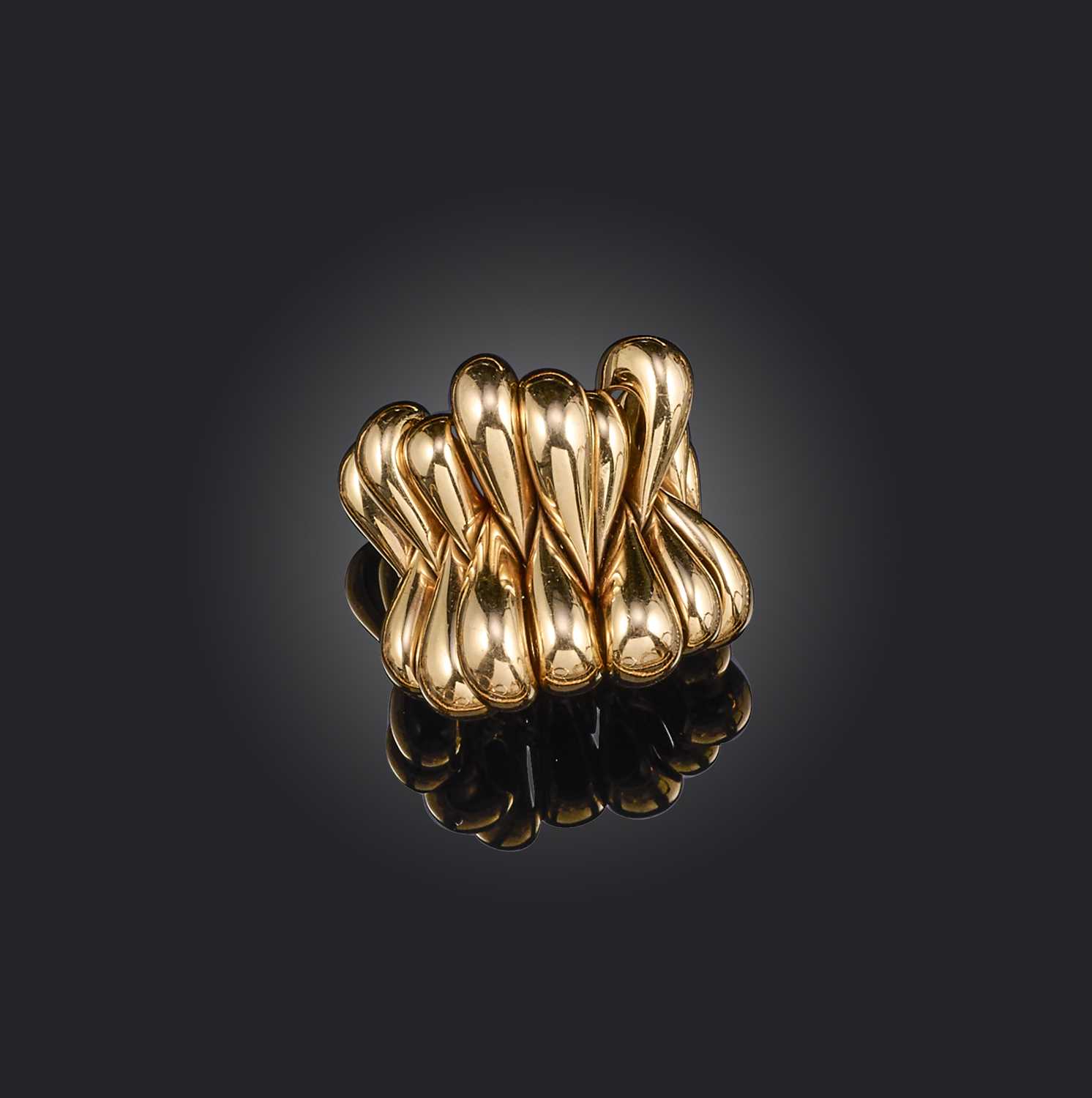 De Grisogono, a gold dress ring, formed of articulated teardrop sections in polished yellow gold,