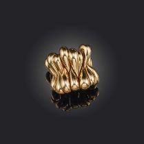 De Grisogono, a gold dress ring, formed of articulated teardrop sections in polished yellow gold,