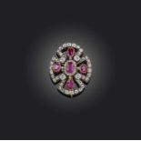 A ruby and diamond brooch, late 19th century, designed as a cross, set with graduated rubies and