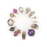 A collection of thirteen gem-set rings, comprising: a diamond cluster ring in 18ct gold, size N1/