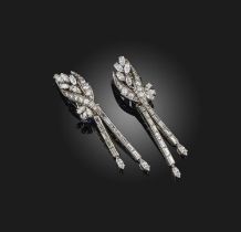 A pair of diamond 'day and night' earrings, mid 20th century, each designed as a foliate surmount