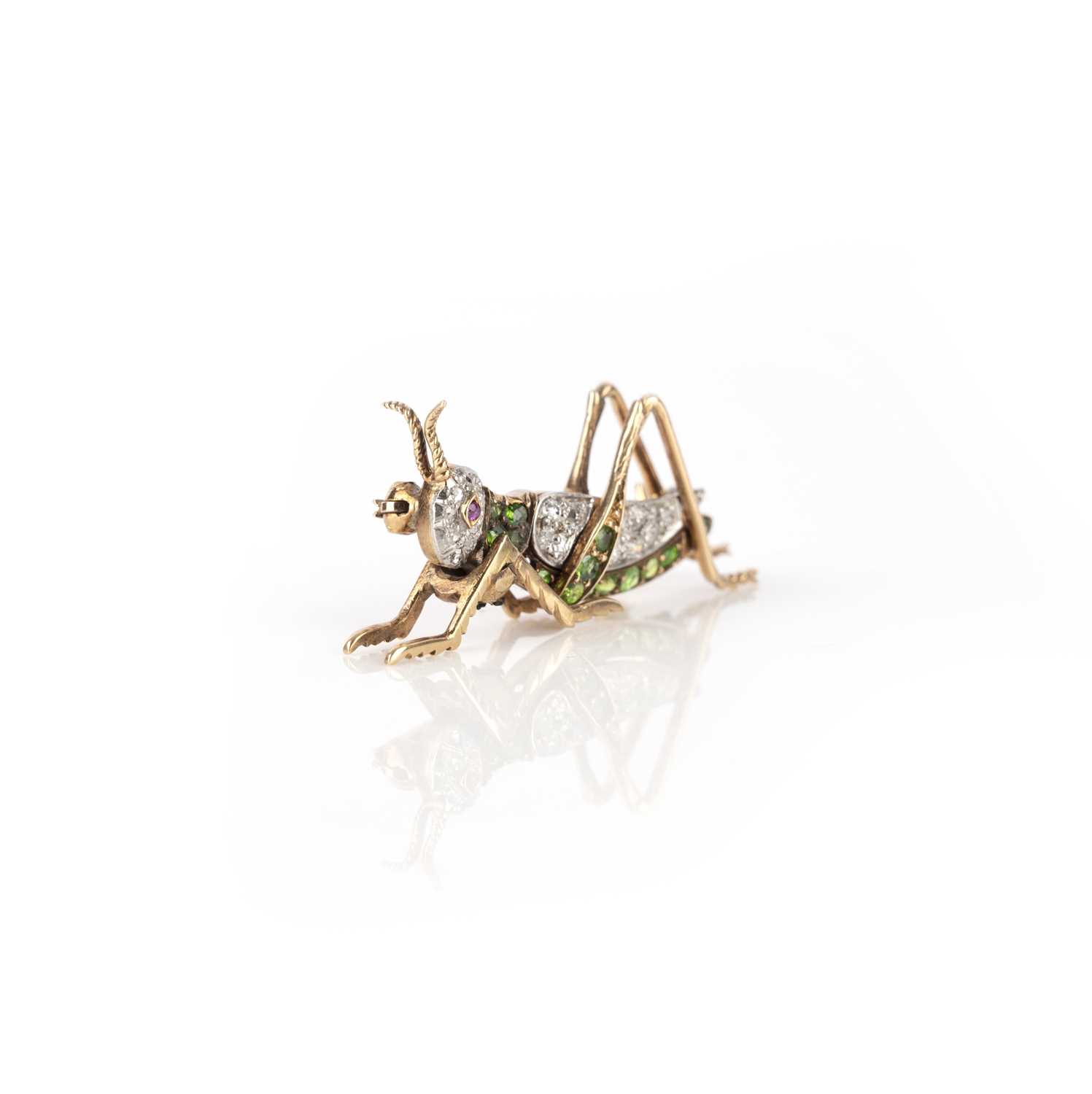 A demantoid garnet, ruby and diamond brooch, early 20th century, designed as a grasshopper, set with - Image 3 of 3