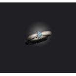 Niessing, a blue diamond 'Spannring' ring, the brilliant-cut blue diamond weighing approximately 0.