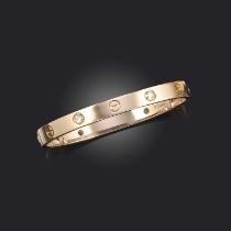 Cartier, a diamond 'LOVE' bangle, set with four round brilliant-cut diamonds in yellow gold, inner